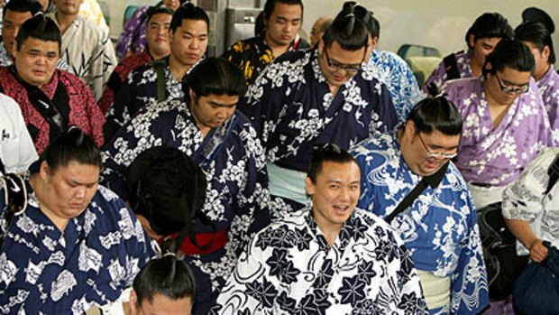 Young sumo wrestlers arrive in Nagoya in central Japan for a tournament that the national broadcaster may refuse to cover following revelations about the sport's criminal links.