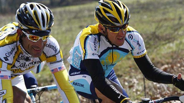 George Hincapie (left) rides alongside Lance Armstrong during the 2009 Milan-San Remo cycling classic.