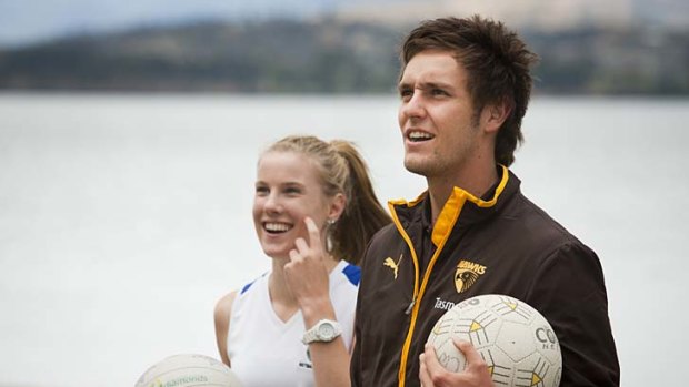 Round ball talk: Jack Gunston with netball fans during ''Walk with a Hawk'' in Hobart.