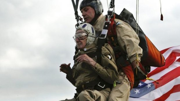 93-year-old US war veteran Jim Martin completes a tandem parachute jump onto Utah Beach, western France, as part of the commemoration of the 70th anniversary of the D Day. 