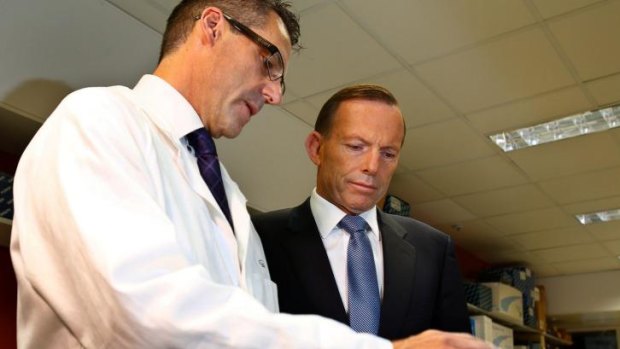 Prime Minister Tony Abbott with Professor Ricky Johnstone, on a visit to the Peter MacCallum Cancer Centre in Melbourne.