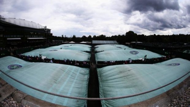  A general view of the rain covers on the outside courts on day six of the Wimbledon on Saturday.