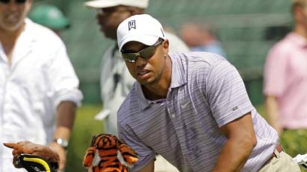 Tiger Woods practises at Augusta on Sunday in preparation for the Masters.
