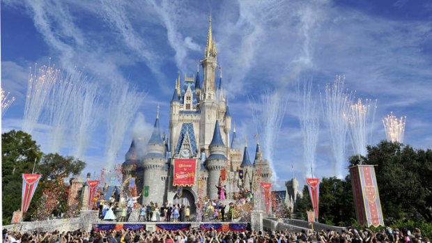 Fireworks light the sky over Cinderella Castle during the Grand Opening of New Fantasyland at Walt Disney World Resort.