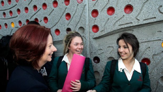 Julia Gillard chats with schoolgirls in Parramatta in western Sydney this morning.