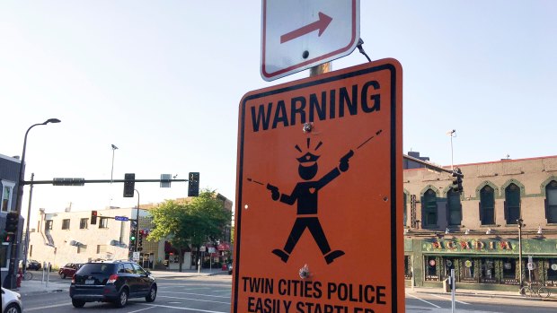 A fake street sign in Minneapolis warns of  "easily startled" police officers. 