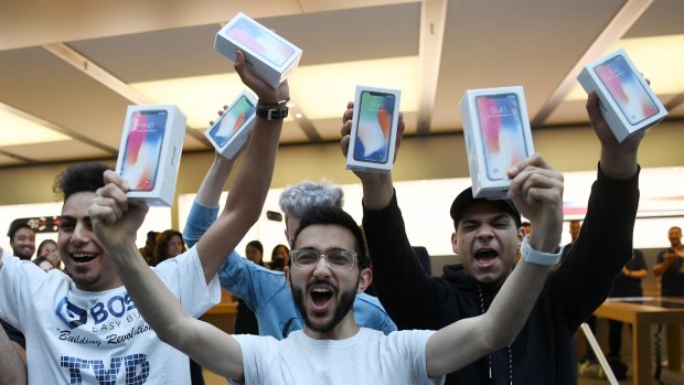Mazen Kourouche, centre, was among the first to get the iPhone X on Friday.