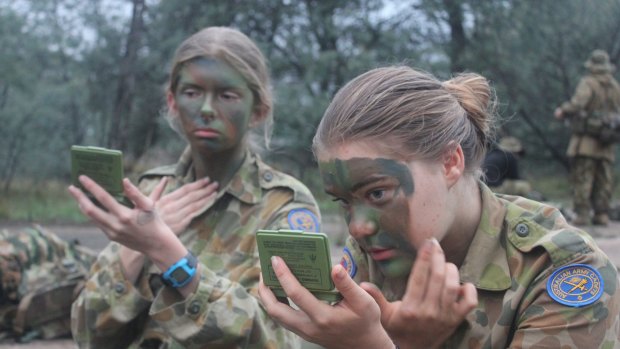 Beyond the face paint: CUO's Charlotte Collier (left) and Sibel Stening seek the leadership skills cadets can offer.