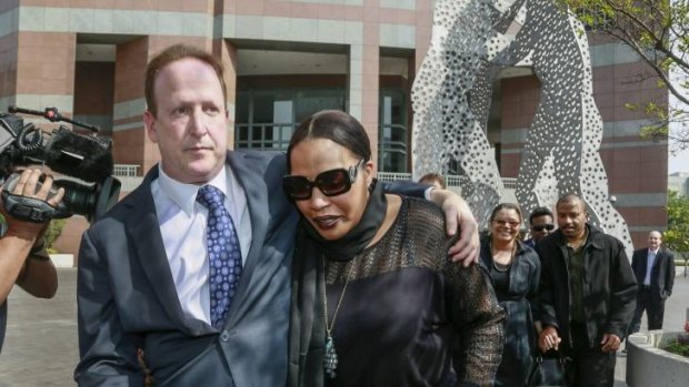 Attorney Richard Busch, left, and Nona Gaye, daughter of the late Marvin Gaye, after a jury awarded the singer's children nearly $US7.4 million.
