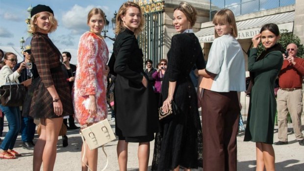 The well dressed and well heeled "Russian mafia" strike a pose outside the shows at Paris Fashion Week.