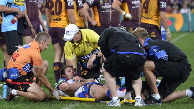 Captain down: Kurt Gidley is stretchered off.