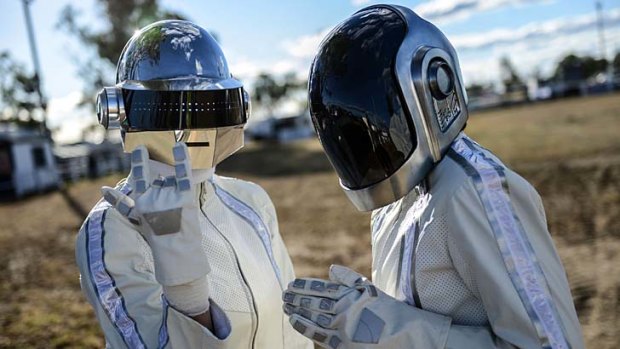 Fans wearing Daft Punk style helmets arrive at Wee Waa before the album launch.