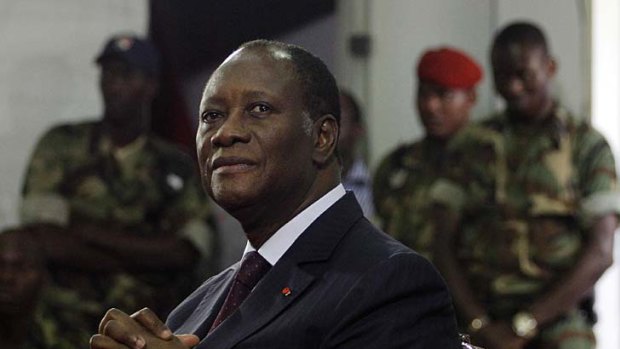 New beginning . . . Alassane Ouattara meets with  officers from the republican forces in Abidjan.
