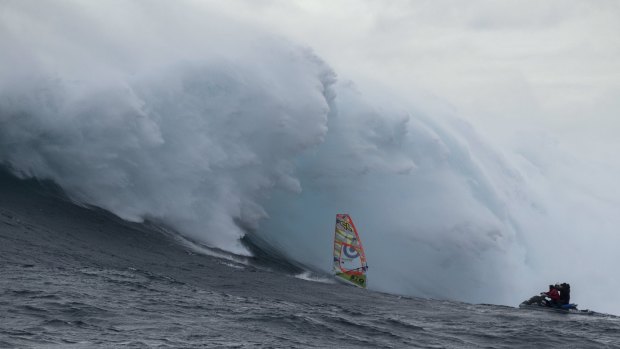 Chased by a monster.  Alastair McLeod rides the Eddystone Rock/Pedra Branca wave 
