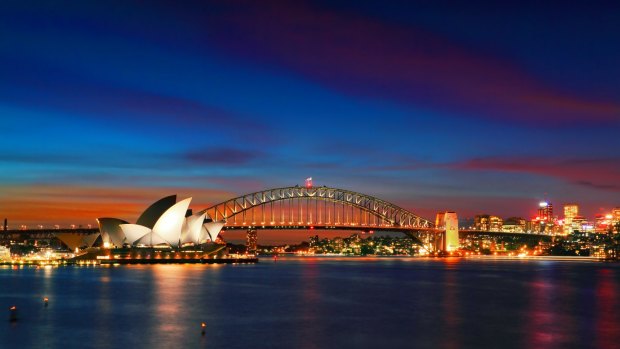 Iconic Sydney: the Sydney Opera House and Sydney Harbour Bridge at  sunset.