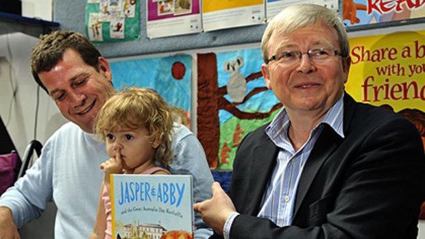 First things first ... Rhys Muldoon and his daughter Lotte, with Kevin Rudd, at yesterday’s launch.