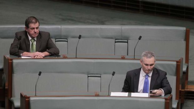 Not quite cloud nine &#8230; Peter Slipper and Craig Thomson cut lonely figures during question time in Parliament on Monday.