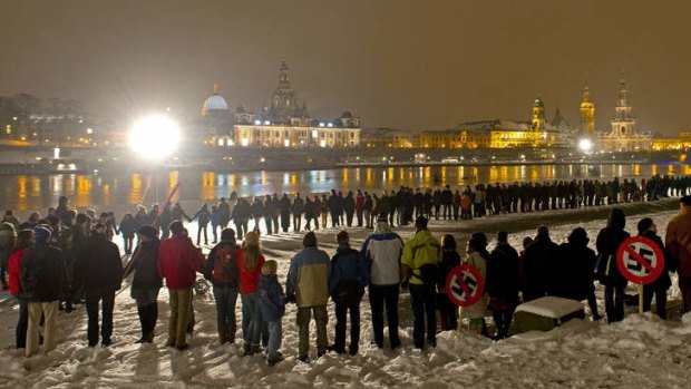 Human chain ... thousands of people joined hands along the Elbe river in front of the Dresden historical city centre.