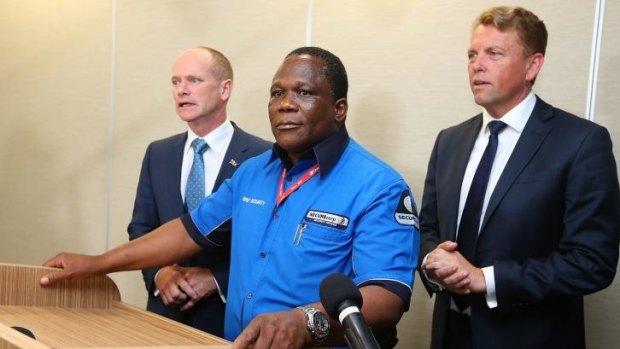 Josphat Mkhawananzi with Premier Campbell Newman and Transport Minister Scott Emerson.