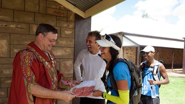 Chris Ord and Lisa Tamati presenting a "telegram" to Alice Springs Mayor Damien Ryan.