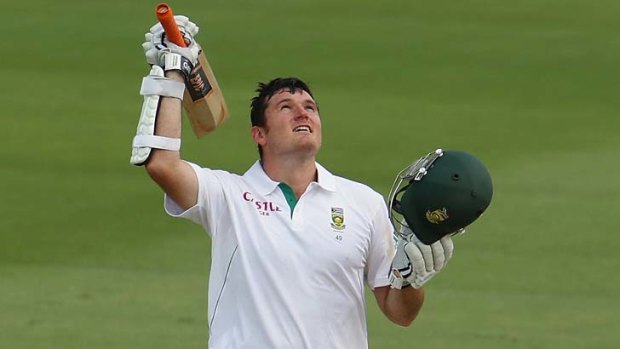 Timely ton: South African skipper Graeme Smith celebrates his century on Friday.