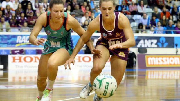 Competitors: Madison Browne of the Vixens and Gabi Simpson of the Firebirds contest the ball last season.