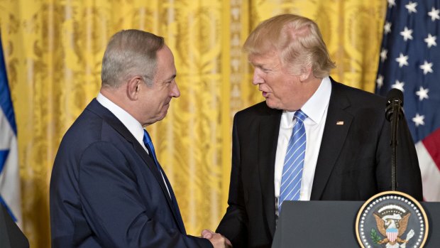 US President Donald Trump, right, shakes hands with Benjamin Netanyahu, Israel's prime minister