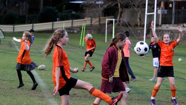 Where do the children play &#8230; football training gets under way at Birchgrove Oval. Competition for sporting fields is becoming fierce as the number of players rises.