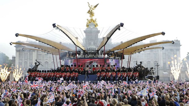 World stage ... Robbie Williams performs to huge crowds outside Buckingham Palace.