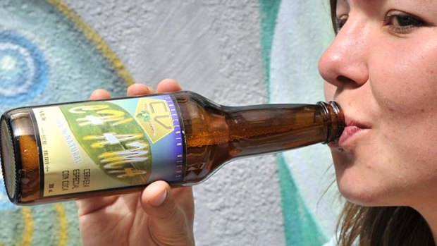 A German tourist drinks Ch'ama, a coca leaves-and-barley-based beer, at a bar in La Paz.
