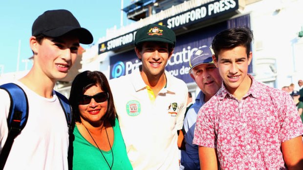 Worth the ticket: Ashton Agar is congatulated by his parents John and Sonia and brothers Wesley and Williams.