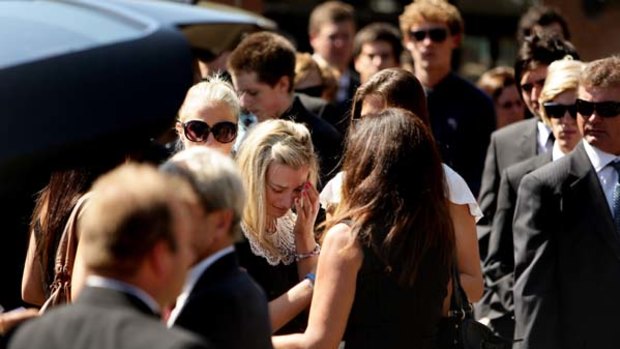 Arielle Bird, centre, the sister of Saxon Bird at his funeral at St Patrick's College in Strathfield.
