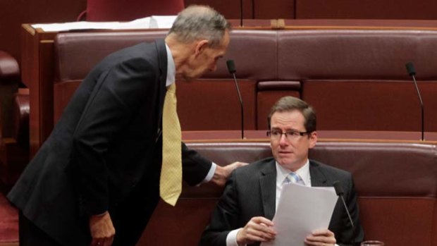 Farewell, Mr Fielding ... Greens leader Bob Brown comforts Senator Steve Fielding after the senator delivered his valedictory speech in Parliament.
