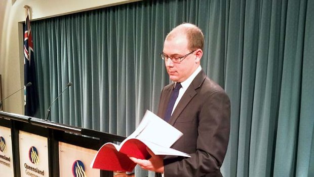 Treasurer Andrew Fraser unveils the budget update.