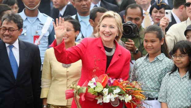 Floral tribute...the US Secretary of State, Hillary Clinton, on her arrival in Jakarta yesterday. Mrs Clinton is hoping to strengthen  ties with South-East Asia.