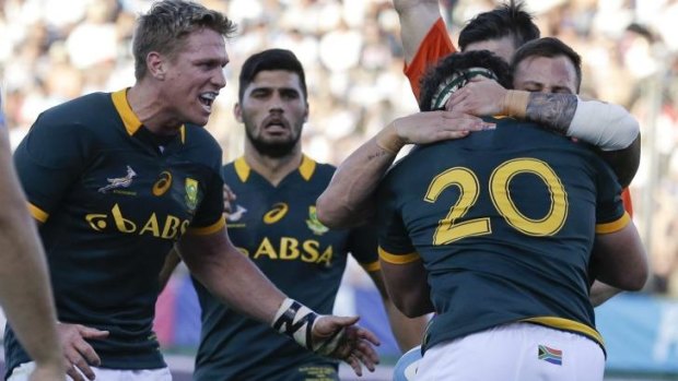 Relief: Marcell Coetzee (20) celebrates scoring a try for South Africa.