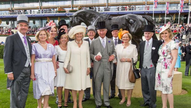 Royals at Royal Ascot ... Black Caviar's owners meet Prince Charles and Camilla as Yeats's statue looks on.