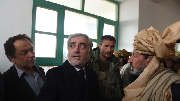Afghanistan's Chief Executive Officer Abdullah Abdullah (second from left) speaks during his official visit to the Yahya Khail district, in Paktika province.