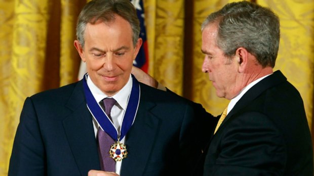 George Bush presents the Medal of Freedom to former British Prime Minister Tony Blair.