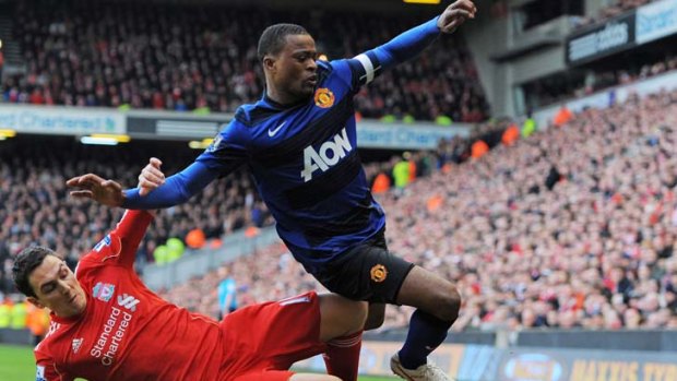 Sent flying ... Stewart Downing does his best to stop Patrice Evra.