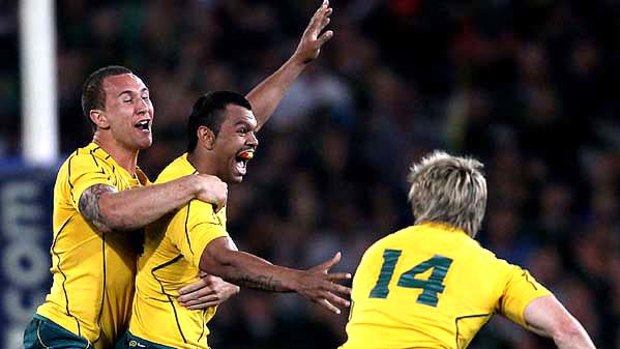 Party time . . . Kurtley Beale, the Wallaby fullback, celebrates with teammates Quade Cooper (L) and James O'Connor after scoring the match winning penalty.