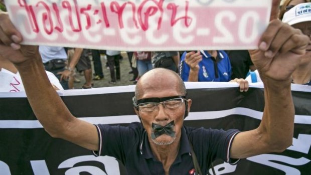 A protester with his mouth taped shut in Bangkok on Wednesday.