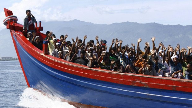 Ethnic Rohingya refugees from Myanmar are transported to a temporary shelter in Krueng Raya in Aceh Besar in 2013.