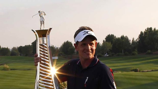 Top of the money lists ... Luke Donald poses with the Race to Dubai trophy.