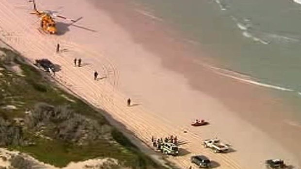 Emergency workers on the beach. <i>Channel Ten</i>
