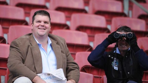 Racing man ... Nathan Tinkler watches trackwork at Moonee Valley. "We are delighted to be able to step in and support the club," he says.