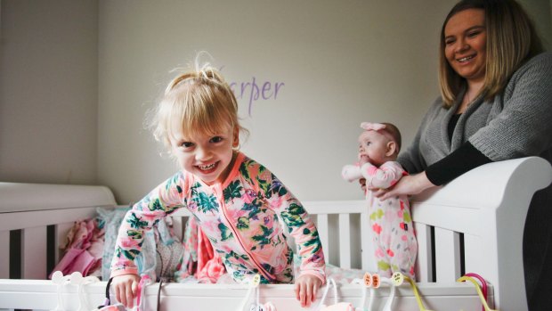 Ashley Cullens and her daughters Ava (3) and Harper (six months) at home in Glenmore Park in Sydney.