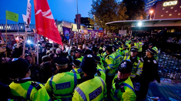 Protesters clash with police at the entrance to the BBC headquarters in west London.