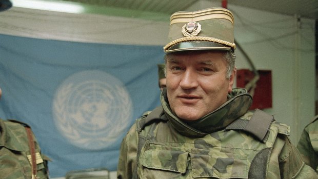 Bosnian Serb commander General Ratko Mladic  pictured near a United Nations flag at Sarajevo Airport in 1993. 