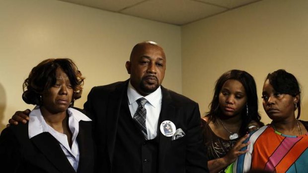 Monica McBride (left) and Walter Ray Simmons, parents of shooting victim Renisha McBride, speak to reporters after their daughter's funeral service in Detroit.